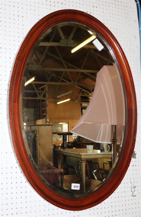 Oval mahogany wall mirror